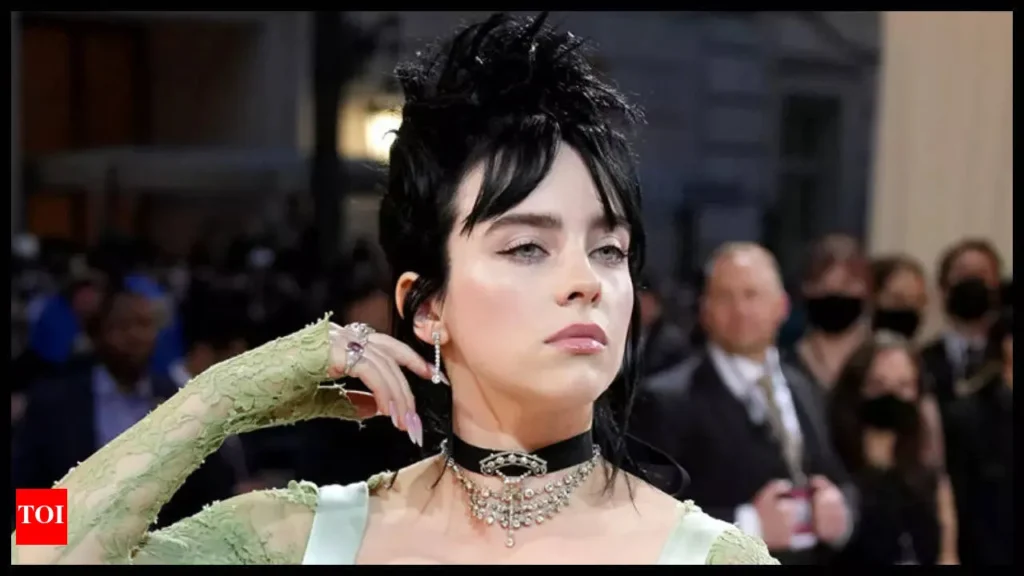 “Infographic of Billie Eilish’s 2026 complete biography, top albums, hit songs, major awards, career timeline, net worth, and fun facts.”