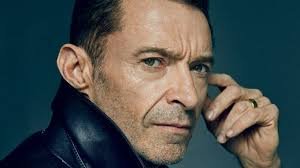 Comparison infographic of Hugh Jackman vs Nicolas Cage, highlighting acting style, net worth, awards, career achievements, and movie success in 2026.