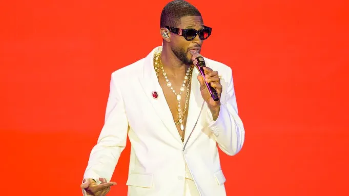 "Infographic of Usher Raymond IV 2026 biography, highlighting career milestones, top albums, Grammy wins, Super Bowl LVIII performance, business ventures, and net worth."